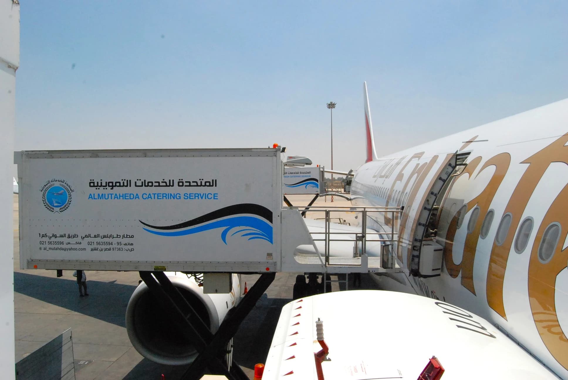 United catering truck connected to an aircraft