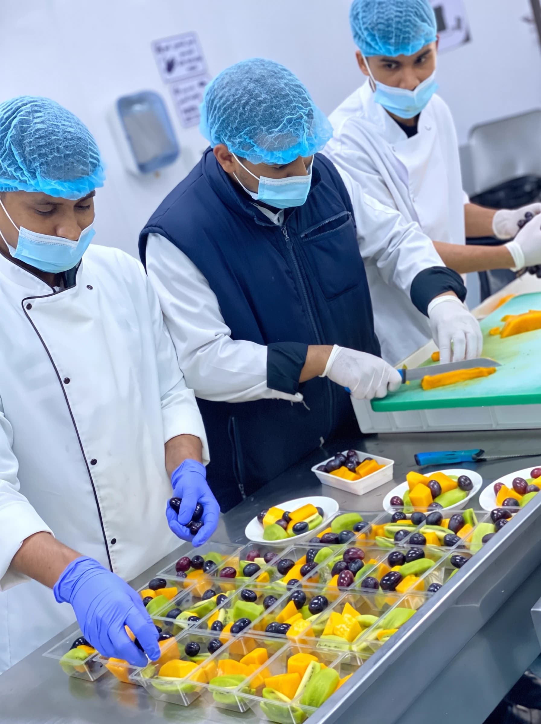 Catering team following controlled food preparation procedures